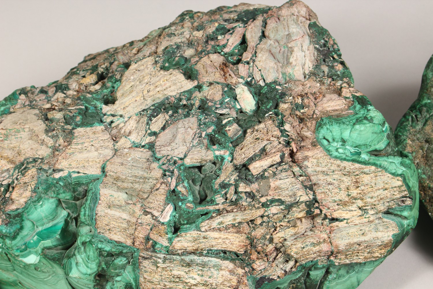 A LARGE NATURALISTIC PIECE OF MALACHITE, partially carved to form a dish, and two similar pieces ( - Image 8 of 9