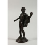 A SMALL BRONZE ROMAN STYLE FIGURE OF A MAN. 4ins high.
