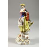 A MEISSEN FIGURE OF A LADY, standing holding a posy, a lamb at her feet. 10.25ins high.
