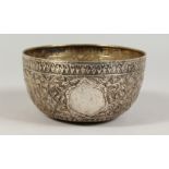 AN INDIAN CHASED AND ENGRAVED CIRCULAR SILVER BOWL. 6ins diameter.