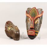 TWO CARVED WOOD AND PAINTED MASKS, one tribal style, the other of an animal (ex The Felix Dennis