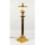 A GOOD BRASS CORINTHIAN COLUMN TABLE LAMP, possibly converted from an oil lamp, with Royal Worcester