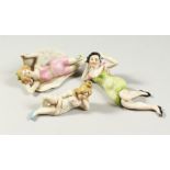 THREE BISQUE PORCELAIN "BATHING BELLES". 3.5ins, 5ins and 5.5ins.