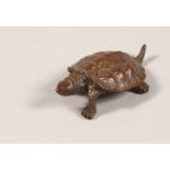 A MINIATURE JAPANESE BRONZE TURTLE. 2.25ins long.