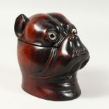 A BLACK FOREST STYLE CARVED WOOD TOBACCO JAR, modelled as a dogs head. 6ins high.