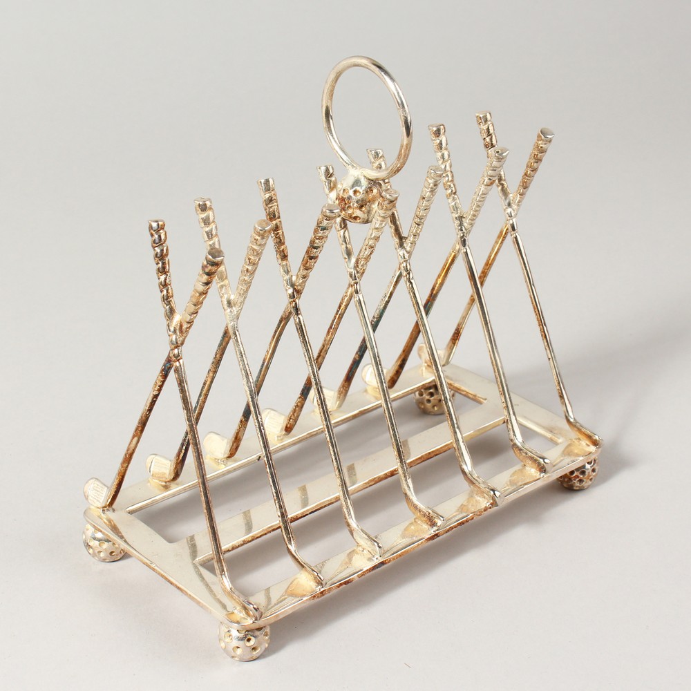 A SIX-DIVISION TOAST RACK, modelled as golf clubs.