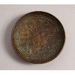 A SMALL CAST BRONZE CIRCULAR DISH. 5.75ins diameter.