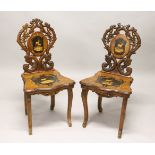 A PAIR OF LATE 19TH CENTURY BLACK FOREST INLAID MUSICAL SIDE CHAIRS, with inlaid backs and seats.