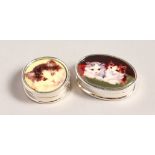 TWO SMALL SILVER PILL BOXES with enamels of cats.