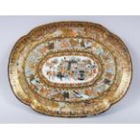 A JAPANESE MEIJI PERIOD SATSUMA SERVING DISH, the dish decorated with scenes of procession, with