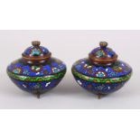 A PAIR OF 20TH CENTURY CHINESE CLOISONNE CENSERS & COVERS, the body decorated with formal foliage