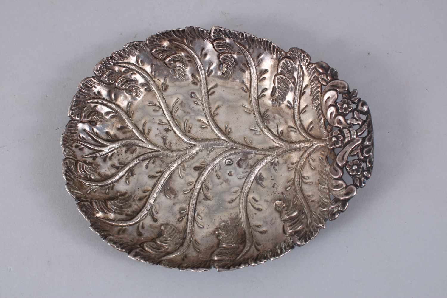 A TURKISH OTTOMAN SILVER LEAF SHAPED DISH, the dish bearing a tughra mark, 18cm x 14.5cm. - Image 2 of 4