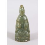 A SMALL CHINESE CARVED JADE / JADE LIKE GUANYIN FIGURE, in a seated position holding a ruyi