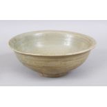 A GOOD CHINESE CELADON PORCELAIN BOWL, possibly yuan / Ming dynasty, 18cm diameter x 7cm high.