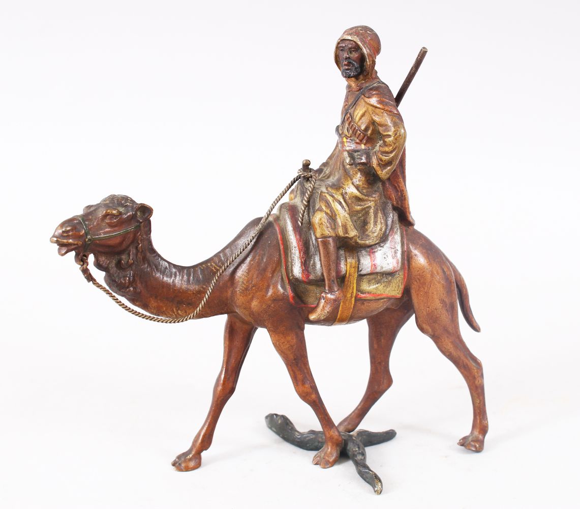 A FINE 19TH CENTURY COLD PAINTED BRONZE FIGURE OF AN ARAB UPON CAMEL BACK, the bronze most likely by