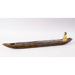 A GOOD JAPANESE EDO PERIOD LACQUER OIL CLOCK BOAT, the rear with a gold lacquer figure with a