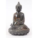 A GOOD CHINESE BRONZE BUDDHA / DEITY, in a meditating position holding a flower and a bottle, 15.5cm