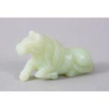 A GOOD 19TH / 20TH CENTURY CHINESE CARVED CELADON JADE RECUMBENT HORSE, 7cm long X 4cm high