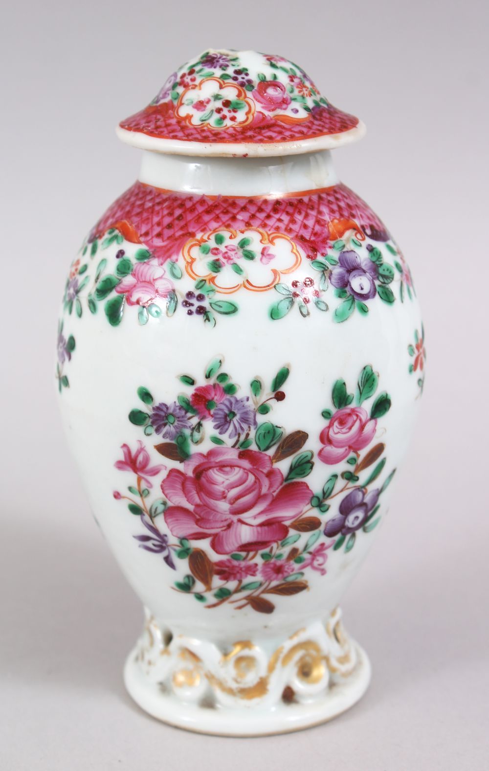 A CHINESE 19TH CENTURY FAMILLE ROSE PORCELAIN TEA CADDY, decorated with floral design, 13cm high.