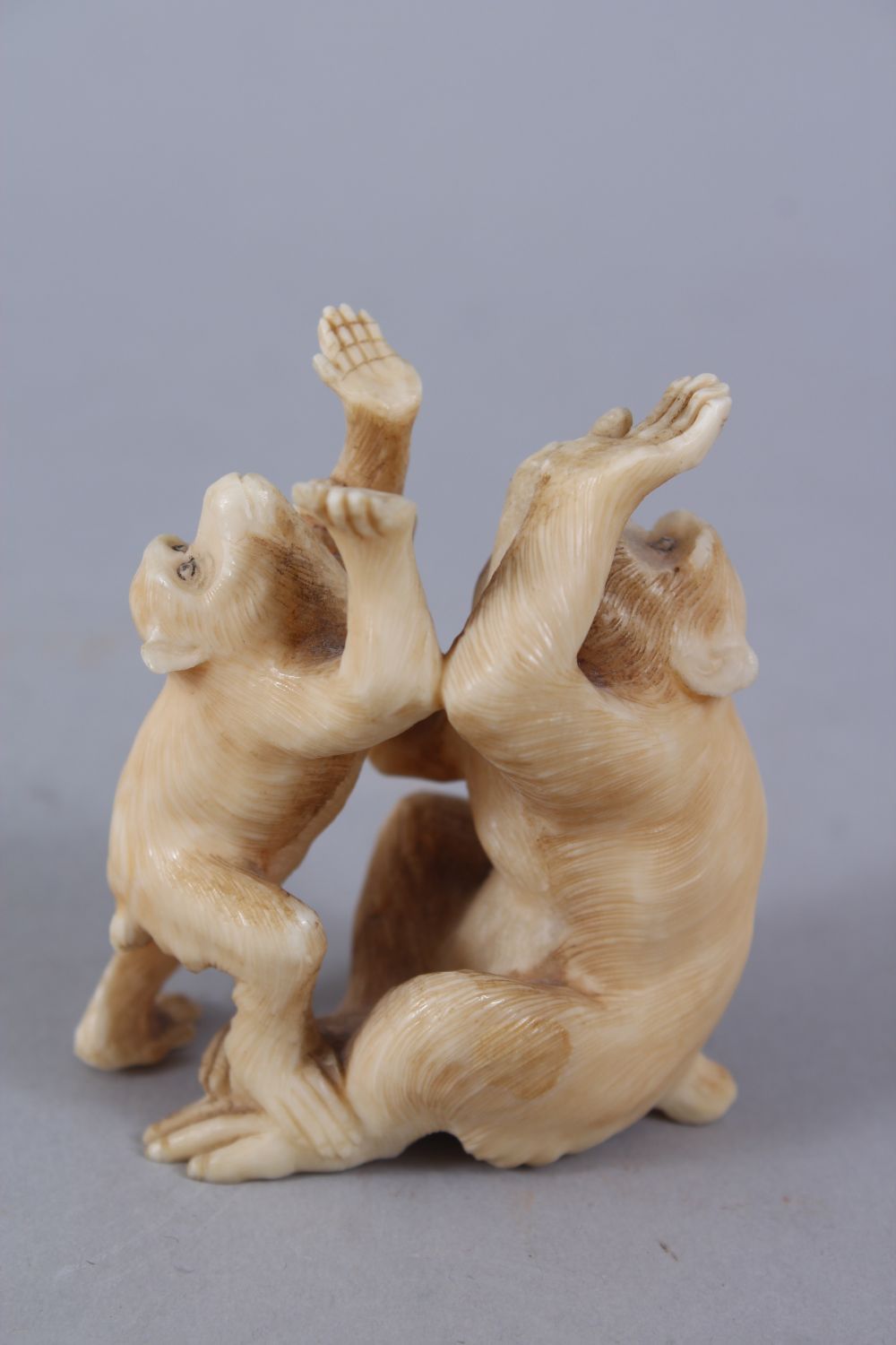 A JAPANESE MEIJI PERIOD CARVED OKIMONO GROUP OF MONKEYS, two seated monkeys play, 6.5cm high x 5cm - Image 3 of 5