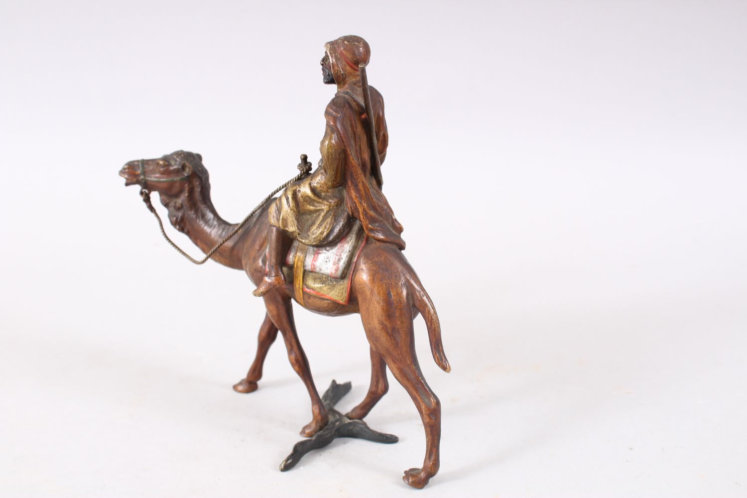 A FINE 19TH CENTURY COLD PAINTED BRONZE FIGURE OF AN ARAB UPON CAMEL BACK, the bronze most likely by - Image 5 of 7