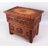AN 18TH / 19TH CENTURY INDIAN KASHMIR FOLDING WOOD MERCHANTS DESK, carved in deep relief to depict
