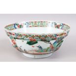 A GOOD KANGXI CHINESE FAMILLE VERT PORCELAIN FAMILLE ROSE BOWL, with panels of floral objects and