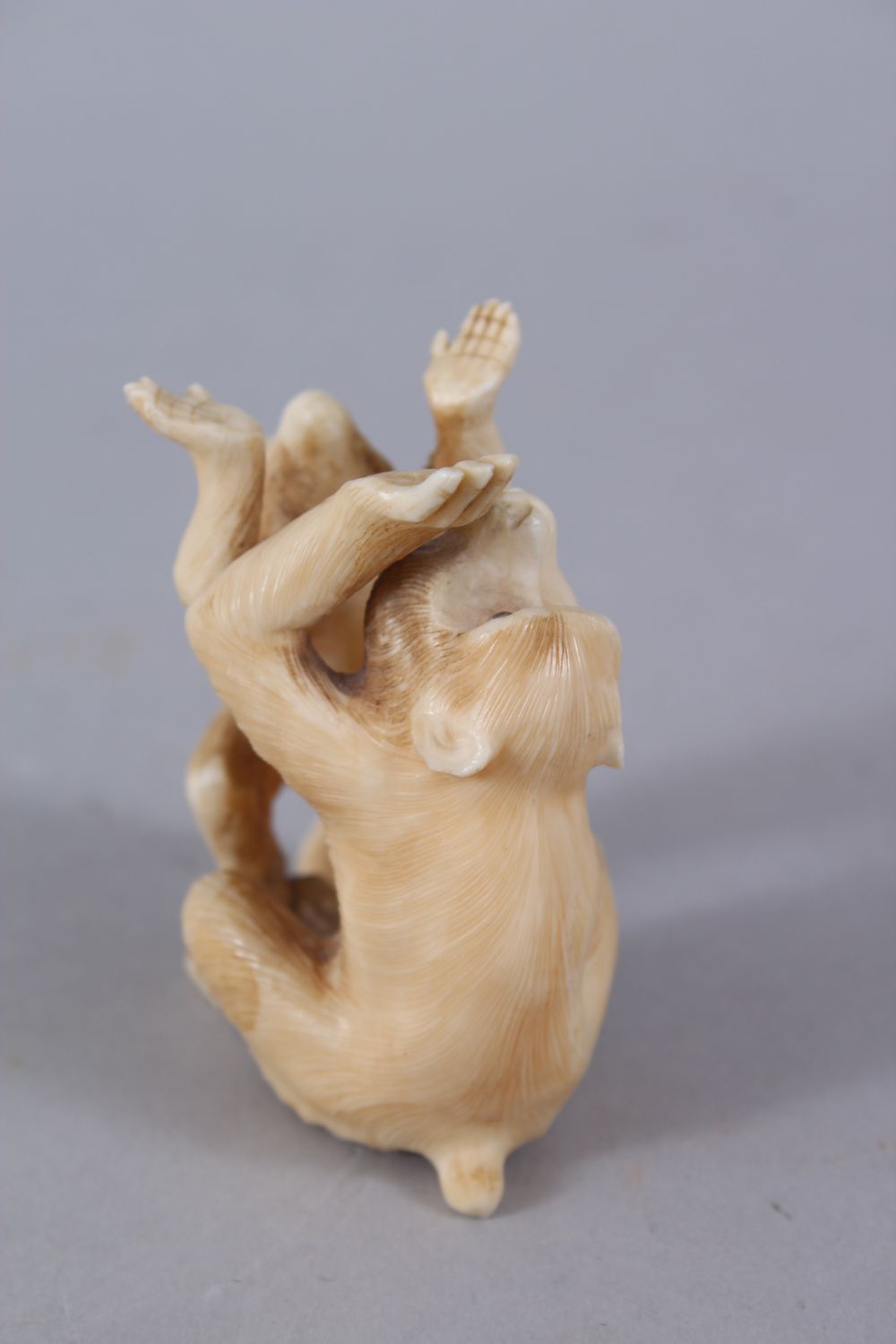 A JAPANESE MEIJI PERIOD CARVED OKIMONO GROUP OF MONKEYS, two seated monkeys play, 6.5cm high x 5cm - Image 2 of 5