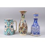 A COLLECTION OF THREE TURKISH POTTERY PIECES, jug 20cm high, mallet shaped blue and white