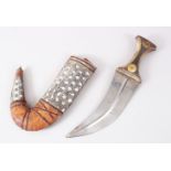 A GOOD PERSIAN JAMBYA DAGGER, with a wooden handle & white metal mounted sheath, 32cm long,