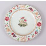 AN 18TH CENTURY CHINESE FAMILLE ROSE PORCELAIN PLATE, decorated with arrays of flora, 22cm