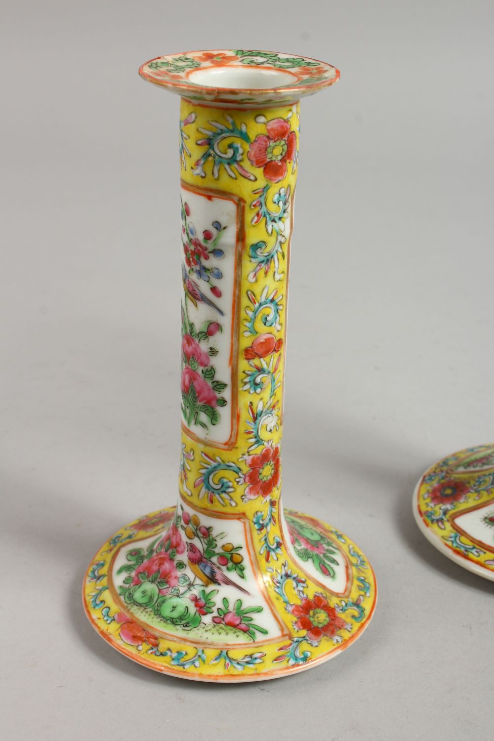 A GOOD PAIR OF CANTON FAMILLE JAUNE CANDLESTICKS with panels of flowers and birds. 7ins high. - Image 4 of 12