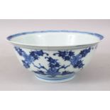 AN UNUSUAL CHINESE KANGXI PERIOD BLUE & WHITE PORCELAIN BOWL, decorated with scenes of foliage and