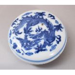 A 19TH / 20TH CENTURY CHINESE BLUE & WHITE PORCELAIN DRAGON INK BOX & COVER, the cover decorated