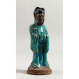 A SMALL MING POTTERY FIGURE OF A GOD with blue glaze. 5.5ins high.