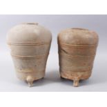 TWO EARLY CHINESE PAINTED TERRACOTTA TAPERING CIRCULAR VESSELS, both on three moulded feet, 28cm &