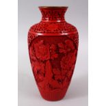 A 20TH CENTURY CHINESE CINNABAR LACQUER VASE, with carved floral decoration and formal scroll,23cm