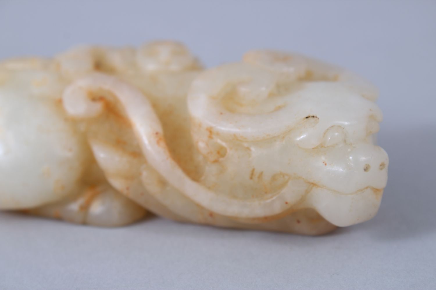 A GOOD 19TH / 20TH CENTURY CHINESE CARVED PALE CELADON JADE BUFFALO FIGURE, in recumbent position, - Image 4 of 6