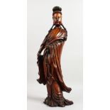 A SUPERB 19TH CENTURY CHINESE CARVED WOOD FIGURE OF GUANYIN holding a sceptre. 22ins high.