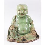 A VERY RARE AND EARLY POSSIBLY SONG - YUAN DYNASTY CHINESE GREEN & BISCUIT GLAZED POTTERY FIGURE
