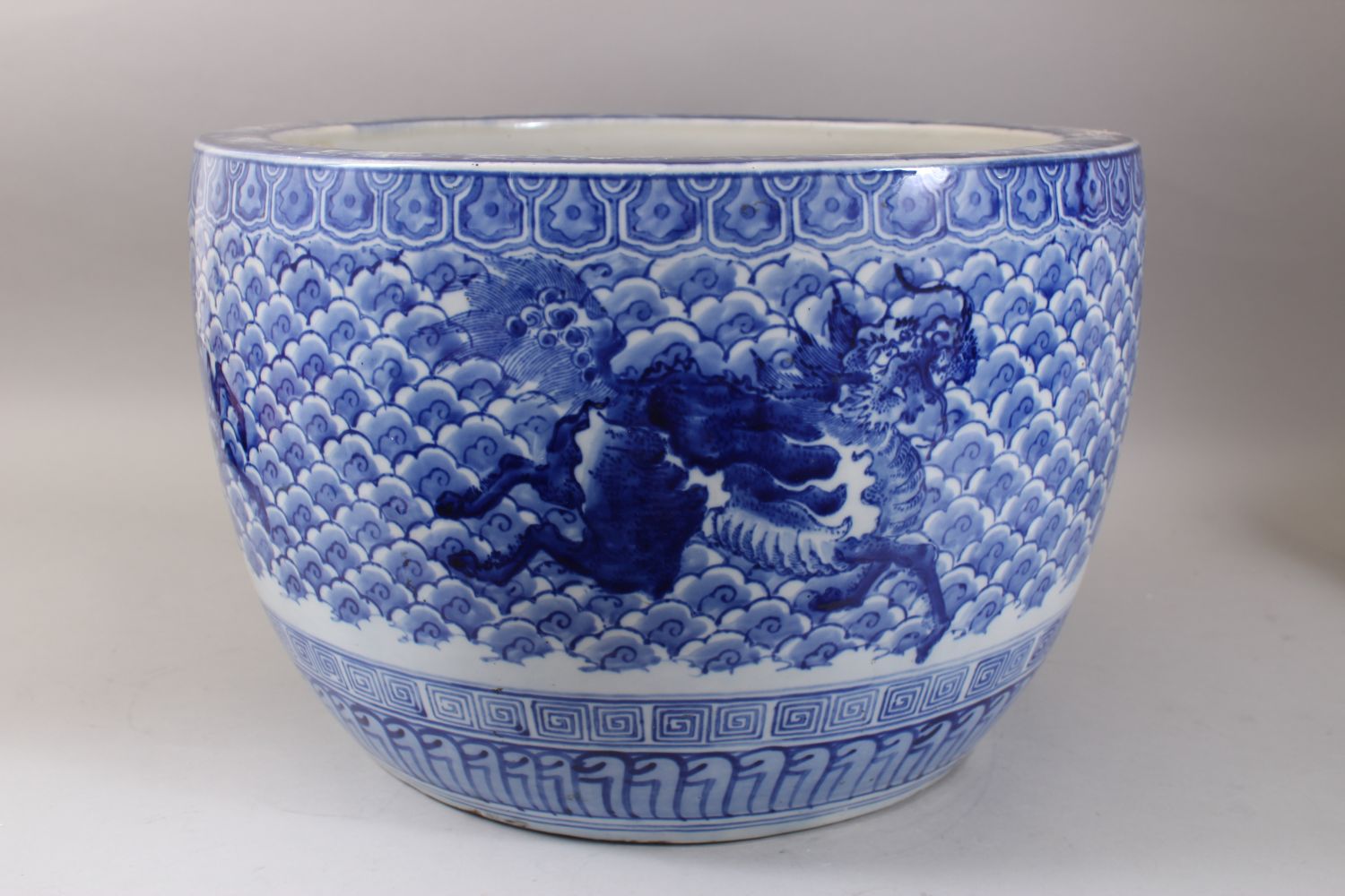 A GOOD JAPANESE MEIJI PERIOD BLUE & WHITE ARITA PORCELAIN JARDINIERE, decorated with scenes of - Image 4 of 6