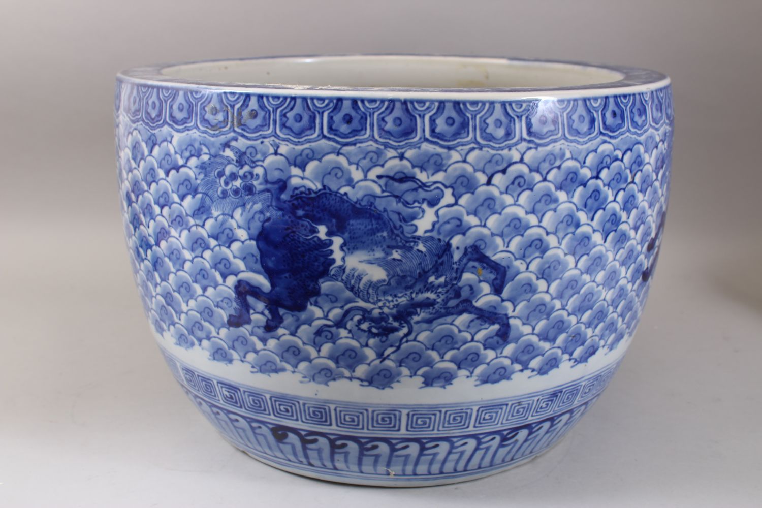 A GOOD JAPANESE MEIJI PERIOD BLUE & WHITE ARITA PORCELAIN JARDINIERE, decorated with scenes of - Image 3 of 6