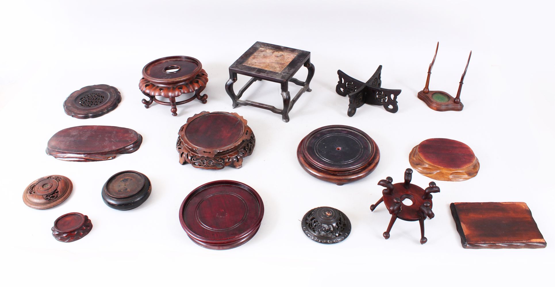 A MIXED LOT OF 15 19TH / 20TH CENTURY CHINESE CARVED AND PIERCED HARDWOOD STANDS, various styles,