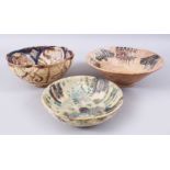 A COLLECTION OF THREE POSSIBLY EARLY ISLAMIC PERSIAN GLAZED POTTERY BOWLS, 23.5CM, 20CM & 18.3CM. (