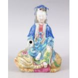 A GOOD 19TH CENTURY CHINESE FAMILLE ROSE PORCELAIN FIGURE OF GUANYIN, seated upon a mythical