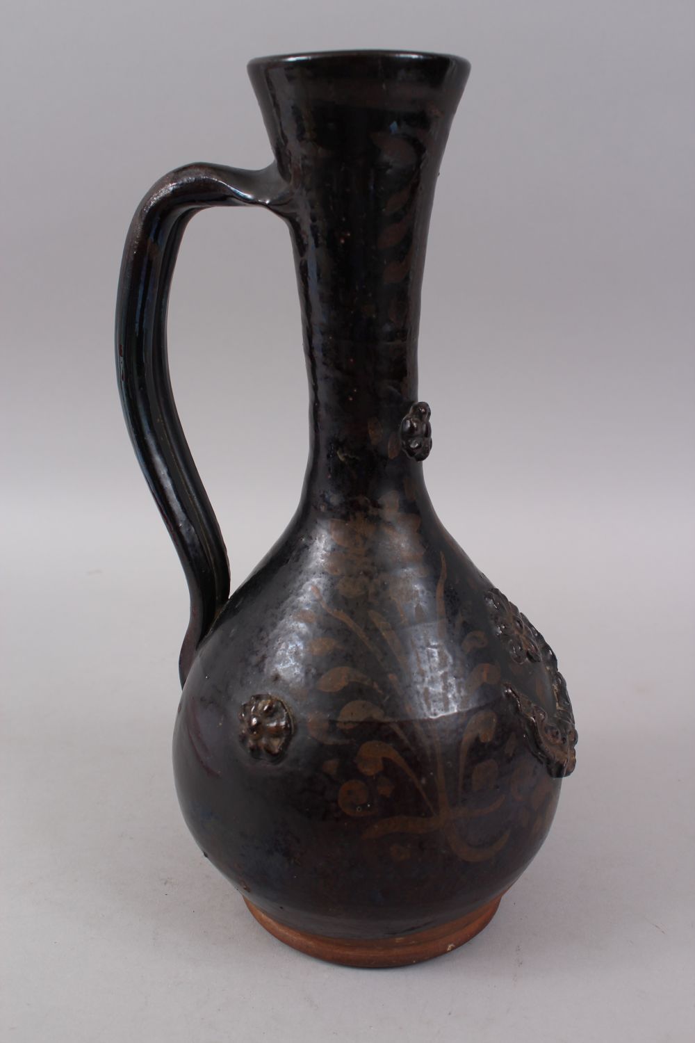 A 19TH CENTURY OTTOMAN TURKISH CANAKKALE BROWN GLAZED JUG, 33cm high. - Image 3 of 4