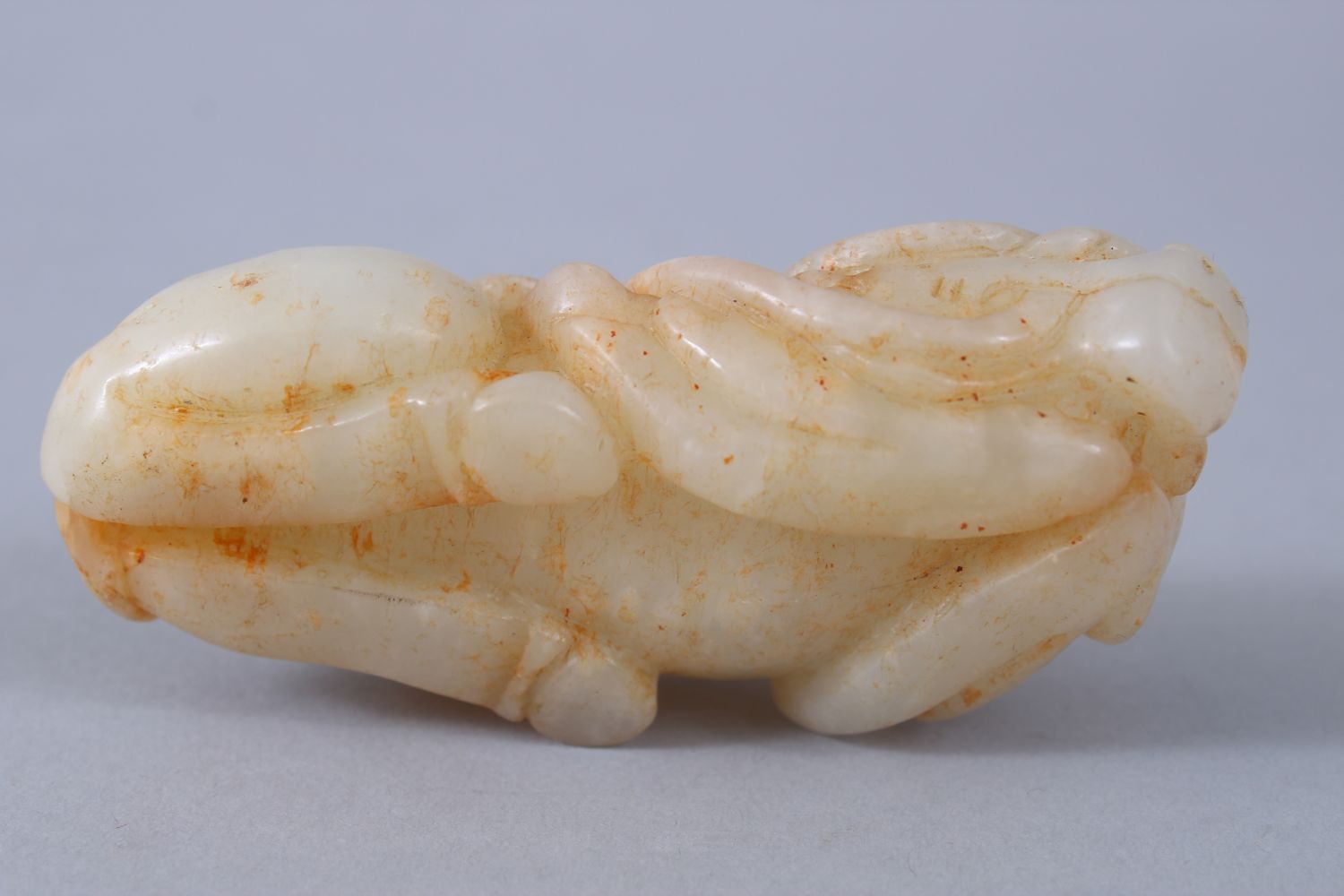 A GOOD 19TH / 20TH CENTURY CHINESE CARVED PALE CELADON JADE BUFFALO FIGURE, in recumbent position, - Image 5 of 6