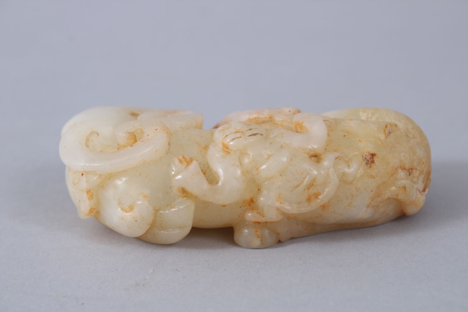 A GOOD 19TH / 20TH CENTURY CHINESE CARVED PALE CELADON JADE BUFFALO FIGURE, in recumbent position, - Image 2 of 6