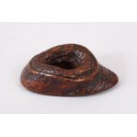 A GOOD JAPANESE MEIJI PERIOD CARVED WOOD OKIMONO OF A ROCK, with a central opening, 6cm wide.