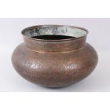 A LARGE 18TH - 19TH CENTURY INDO PERSIAN ENGRAVED COPPER BOWL.